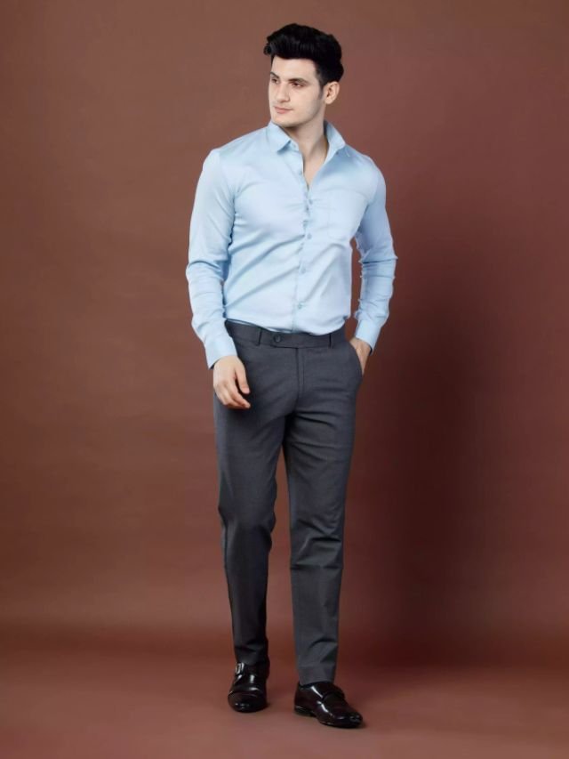 A Men in Charcoal Grey Pants with Light Blue Shirt for office