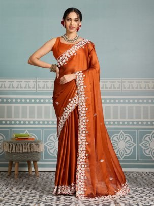 Beautiful Orange Rangoli Silk Fabric With Cutwork Border 