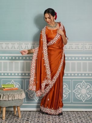 Beautiful Orange Rangoli Silk Fabric With Cutwork Border