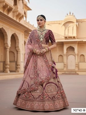 Heavy Embroidery And Zari Work Velvet Wine Lehenga With Net Dupatta