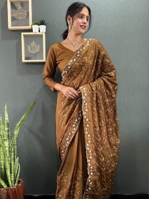 Luxuries Brown Sparkling Georgette Silk Saree Paired With Unstitched Blouse