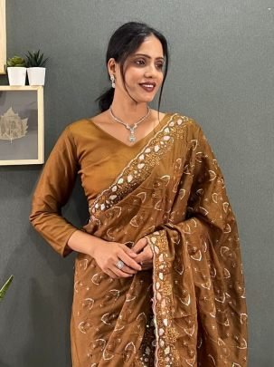 Luxuries Brown Sparkling Georgette Silk Saree Paired With Unstitched Blouse