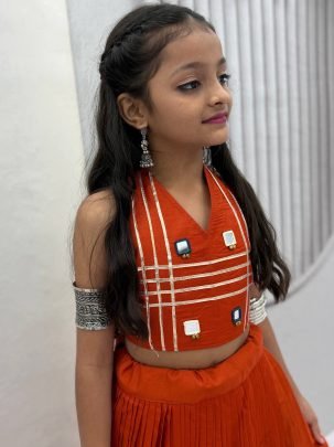 Ribbin Work Orange Colour Kids Navratri Lehenga