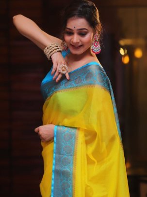 Soft Naylon Chinnon Yellow Saree With Blue Less Pallu And Running Blouse