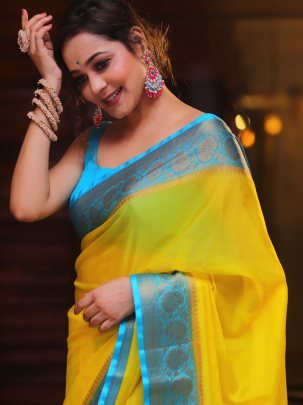 Soft Naylon Chinnon Yellow Saree With Blue Less Pallu And Running Blouse